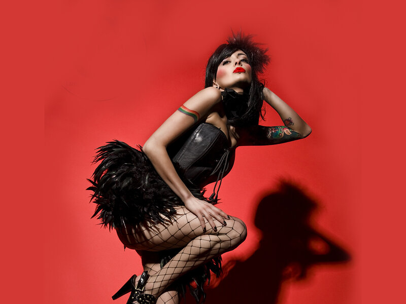 Woman in Feathered Outfit — Red