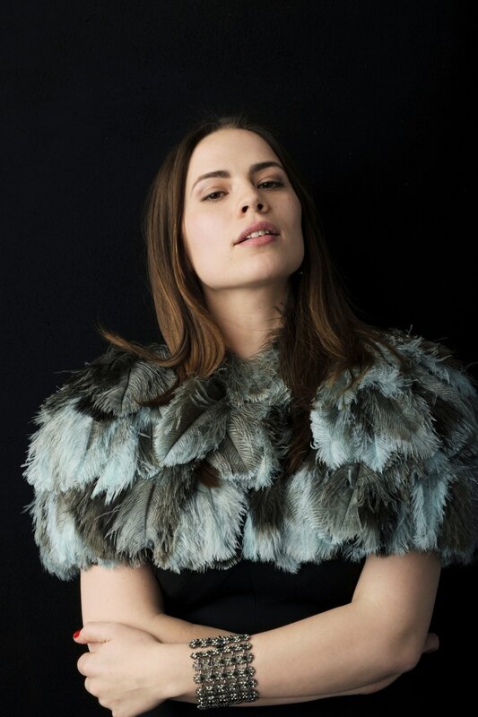 woman in feathered shawl