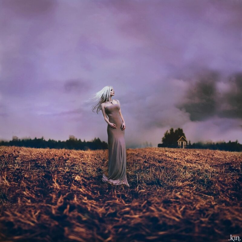 Woman in field at dusk