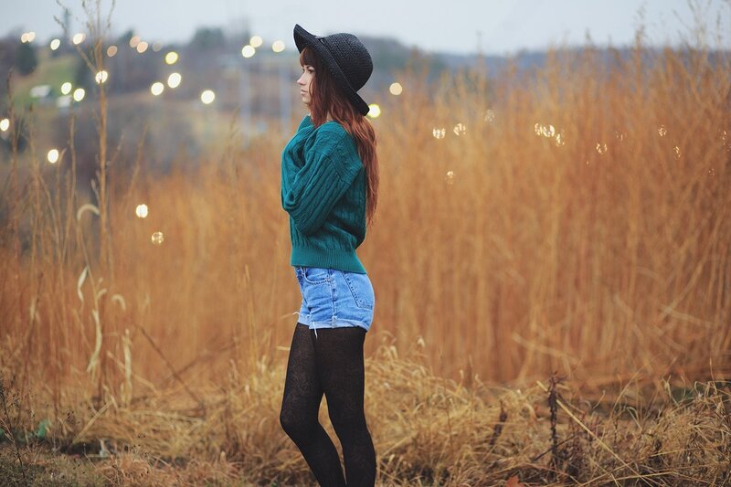 woman in field at dusk