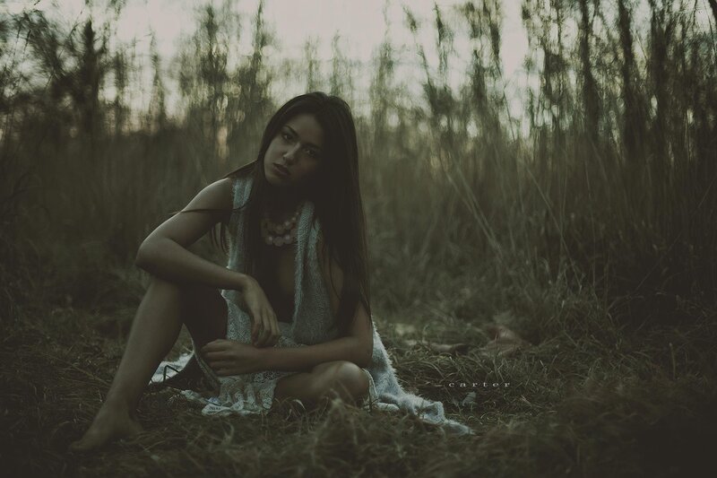 woman in field at dusk