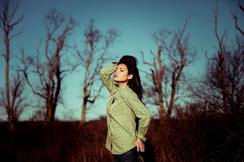 woman in field at dusk