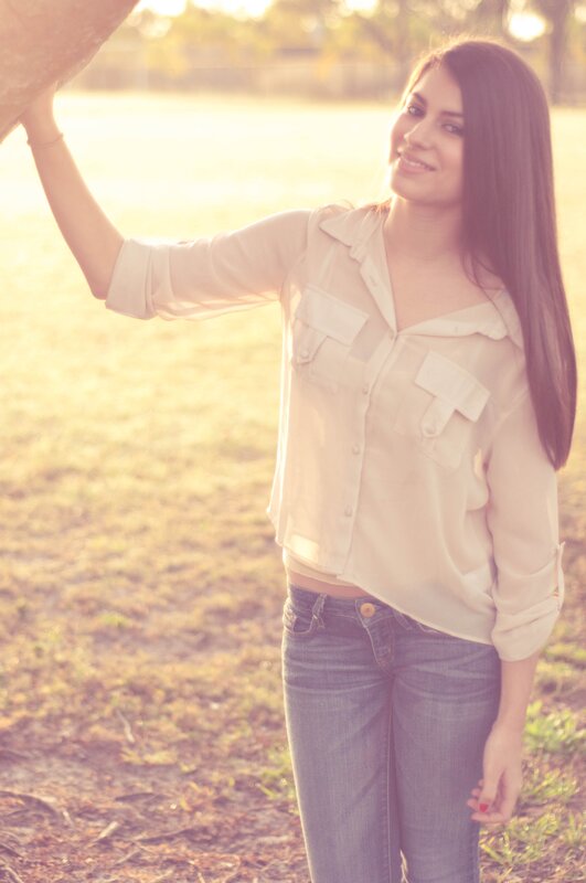 woman in field at sunset