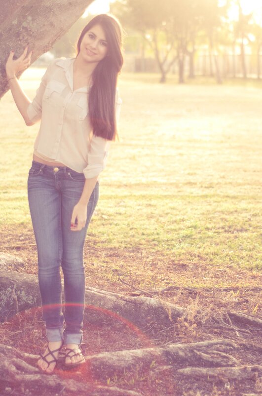 woman in field at sunset