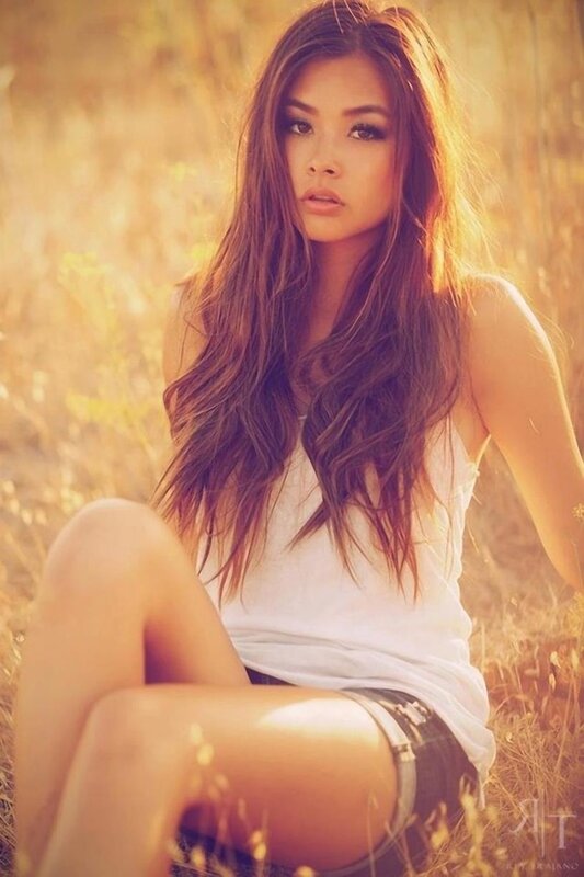woman in field at sunset