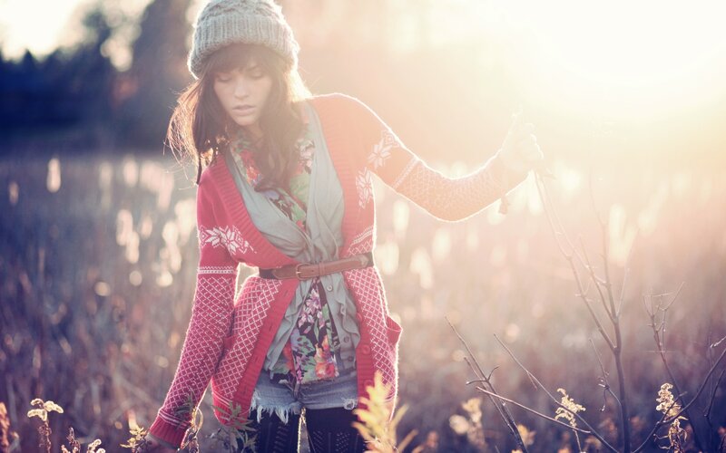 Woman in field at sunset