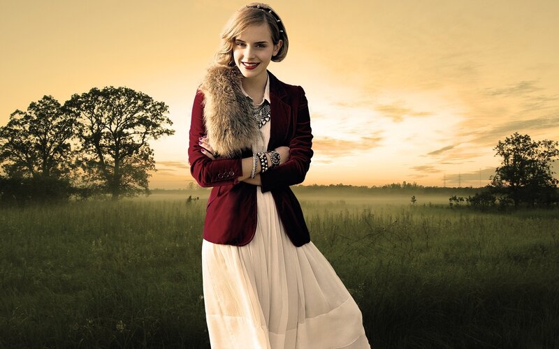 woman in field at sunset