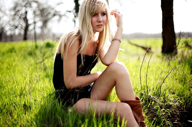 Woman in field at sunset