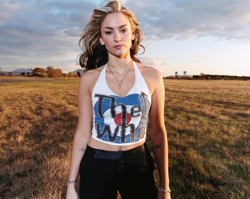 Woman in field at sunset
