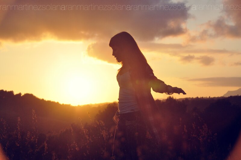 Woman in Field at Sunset — Orange, Dramatic