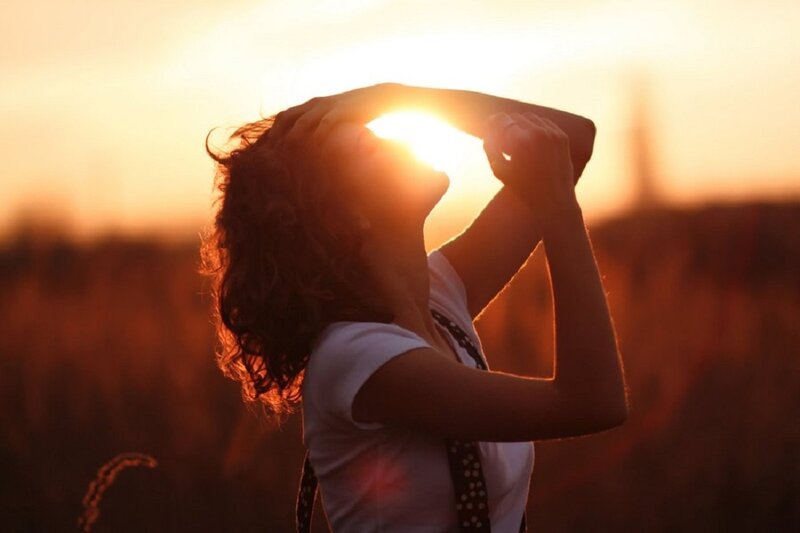 Woman in Field at Sunset — Orange
