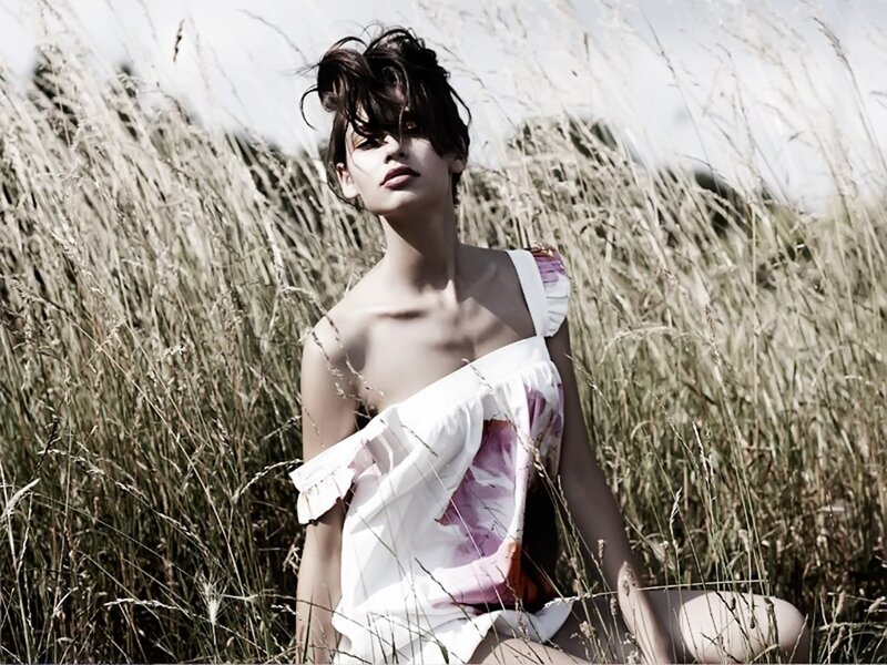 woman in field of tall grass