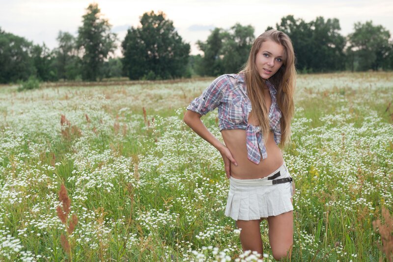 Woman in field of white flowers
