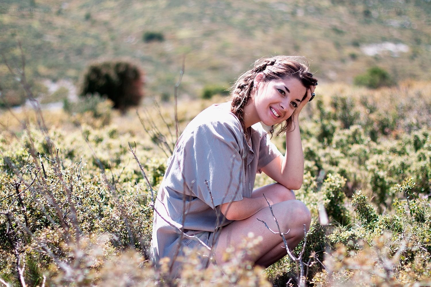 woman in field smiling