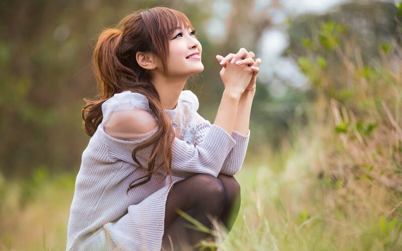 woman in field smiling