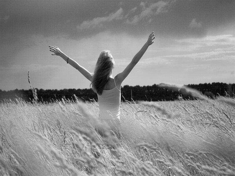 Woman in Field with Arms Raised — Black