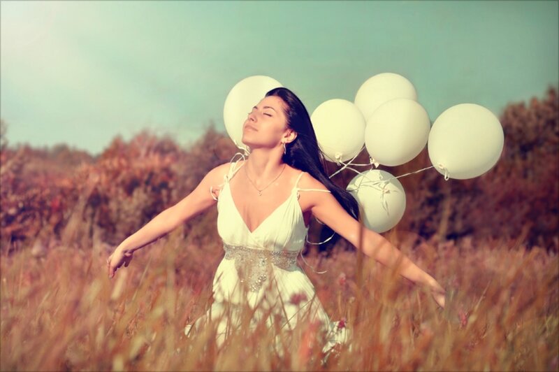 Woman in Field with Balloons