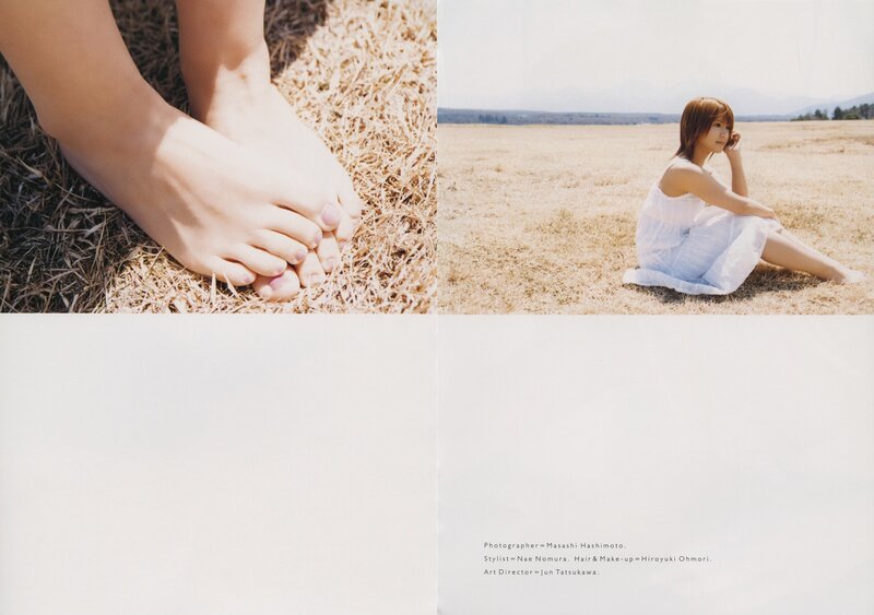 woman in field with bare feet