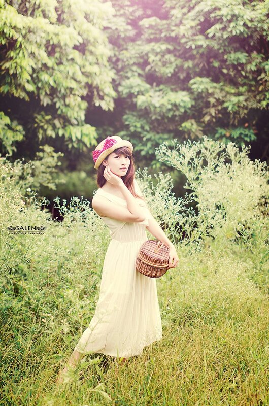 Woman in field with basket