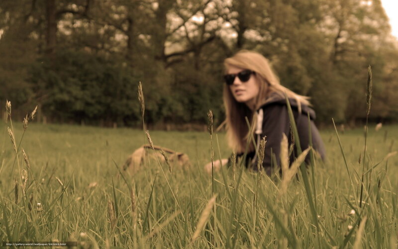 woman in field with dog
