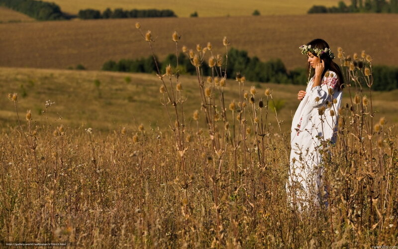 Woman in field with flower crown