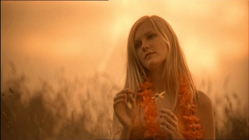 Woman in Field with Flower — Orange