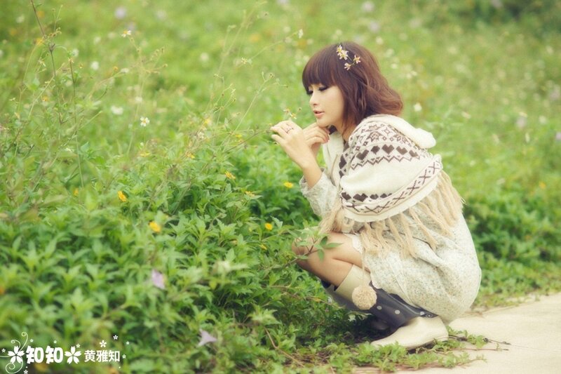 woman in field with flowers