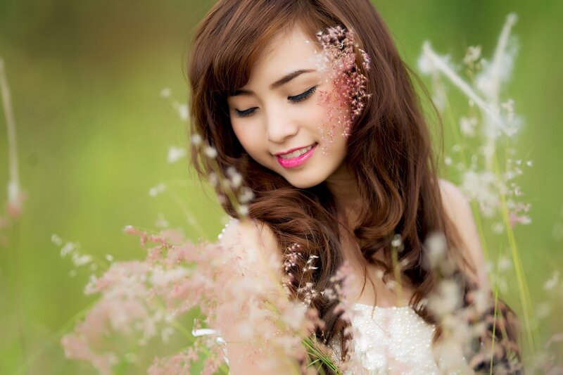 woman in field with flowers