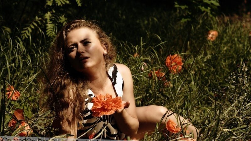woman in field with flowers