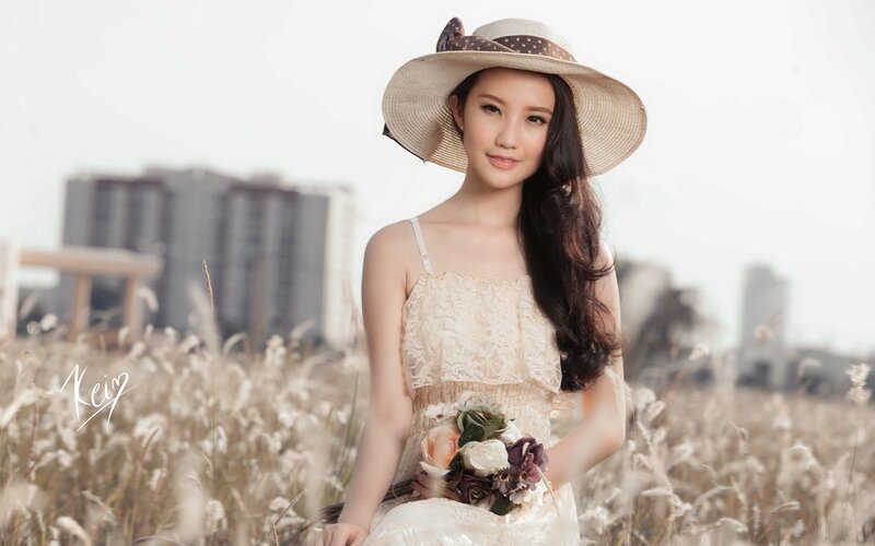 woman in field with flowers