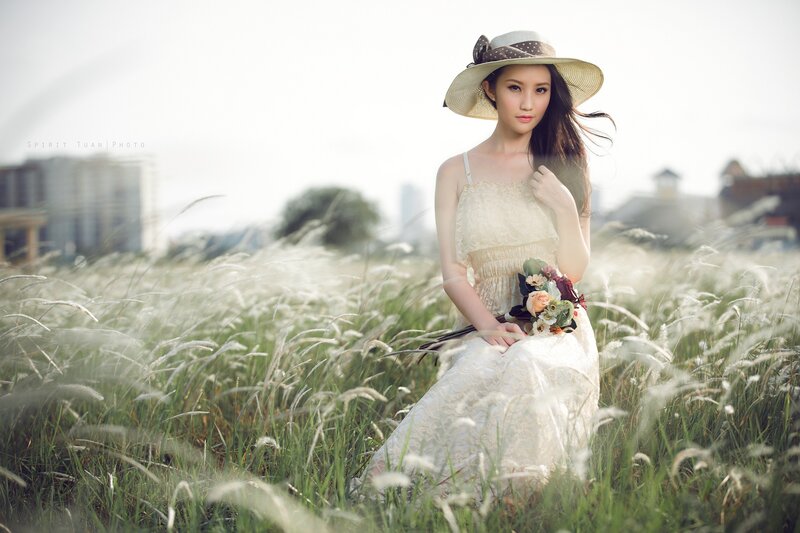 Woman in field with flowers
