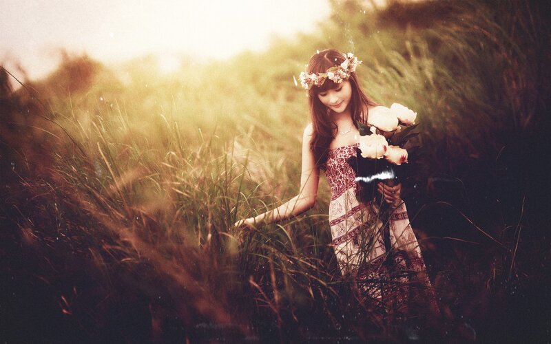 woman in field with flowers