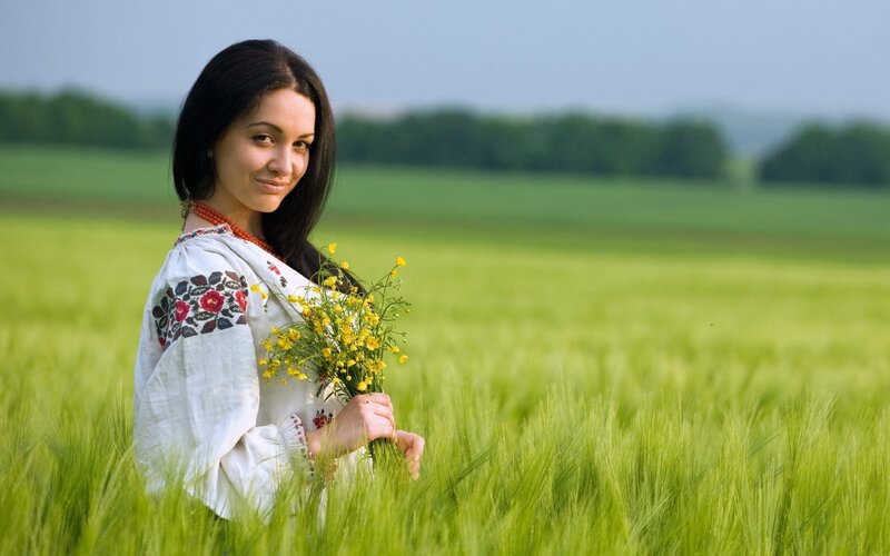 Woman in field with flowers