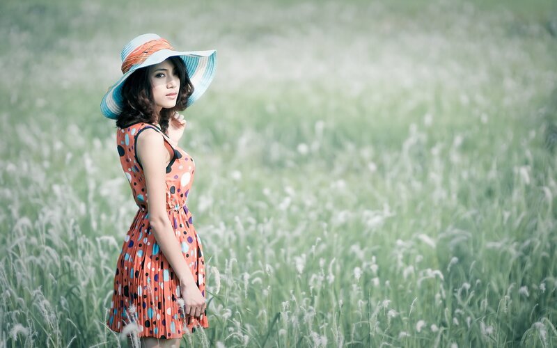Woman in field with hat