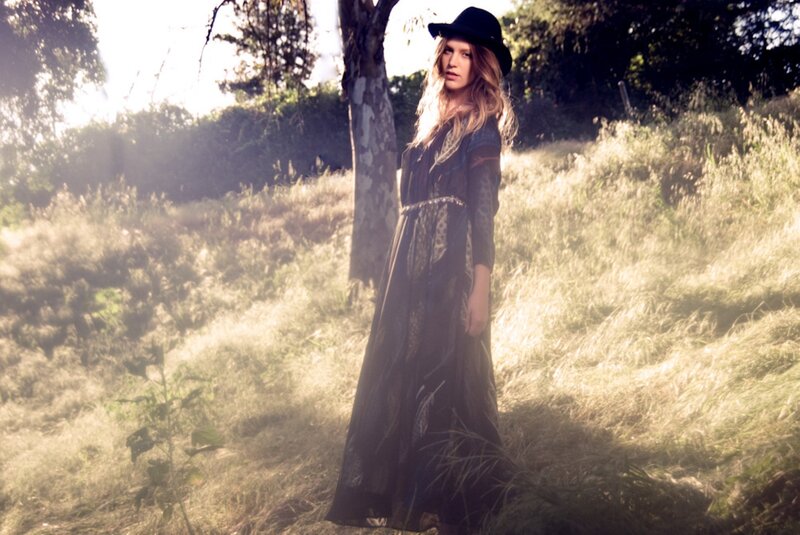 woman in field with hat