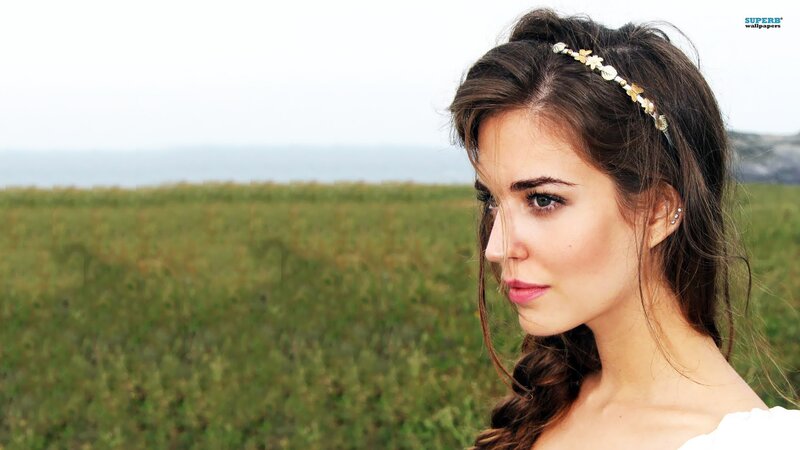 woman in field with headband