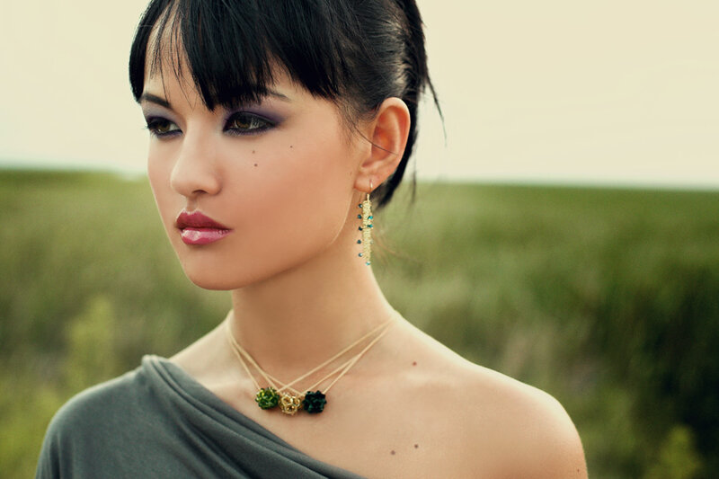 woman in field with jewelry