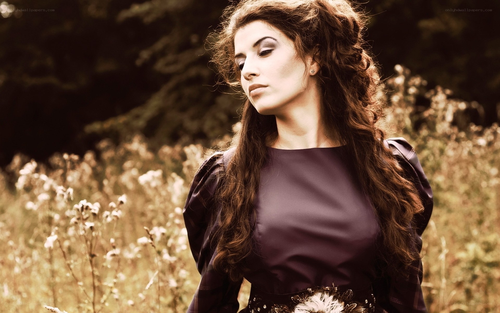 woman in field with long hair