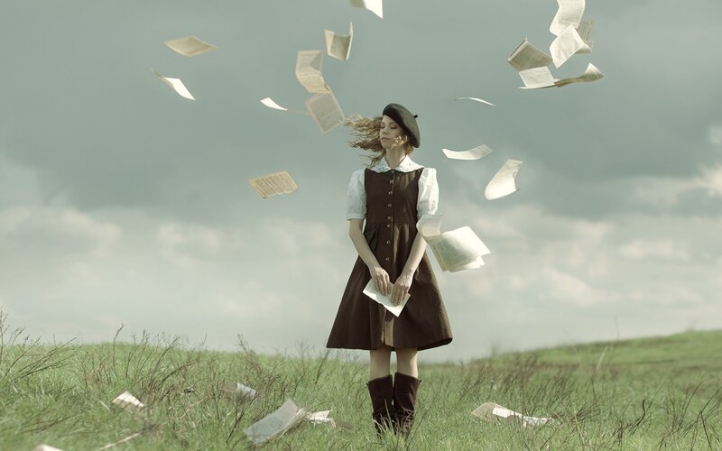Woman in Field with Papers