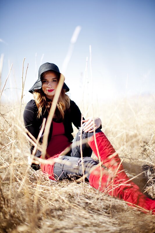 woman in field with red boots