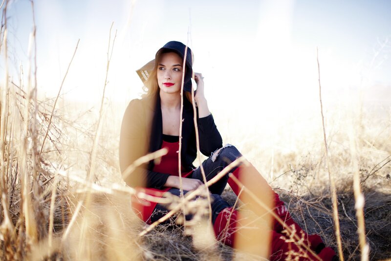 woman in field with red boots