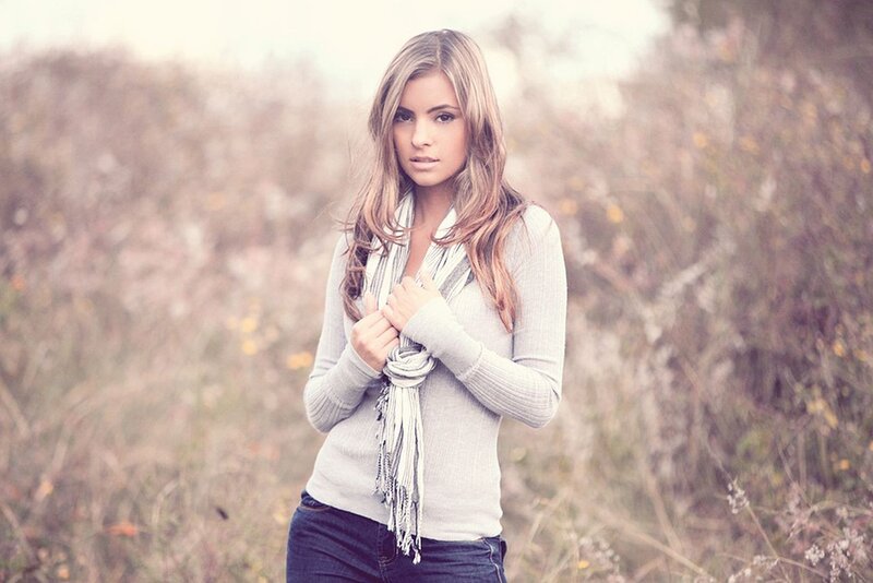 woman in field with scarf