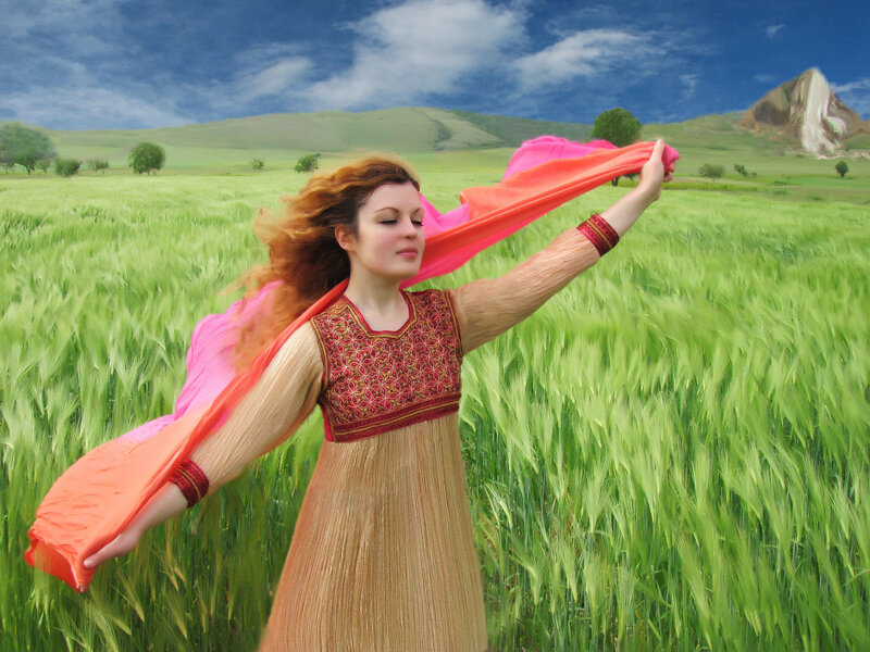 Woman in field with scarf