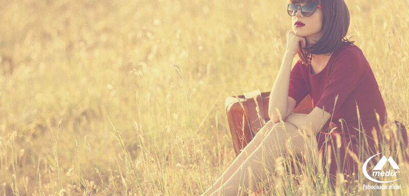 Woman in Field with Suitcase