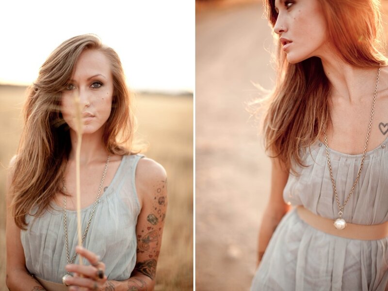 woman in field with tattoos