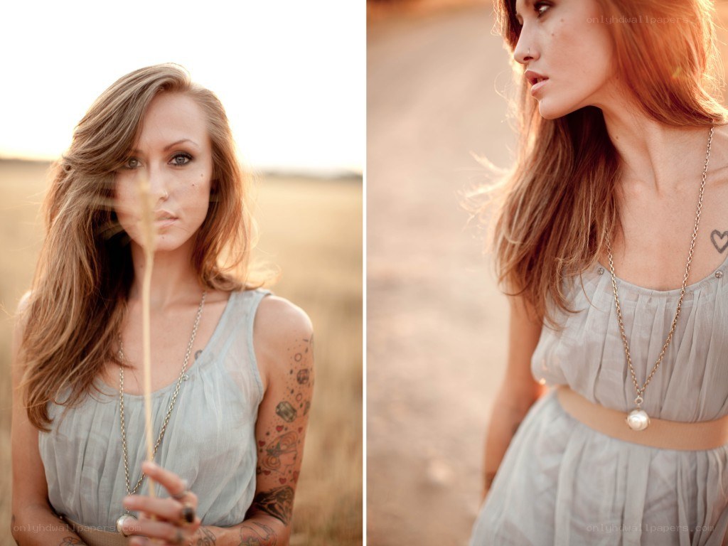 woman in field with tattoos