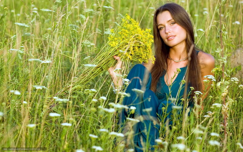 Woman in field with wildflowers