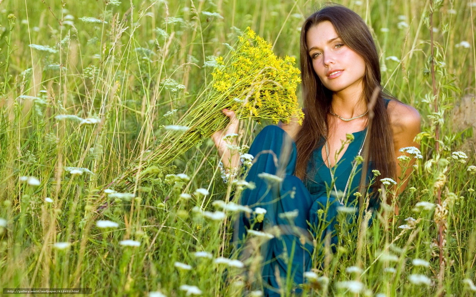 Woman in field with wildflowers