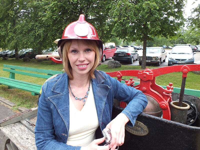 Woman in Firefighter Helmet — Red
