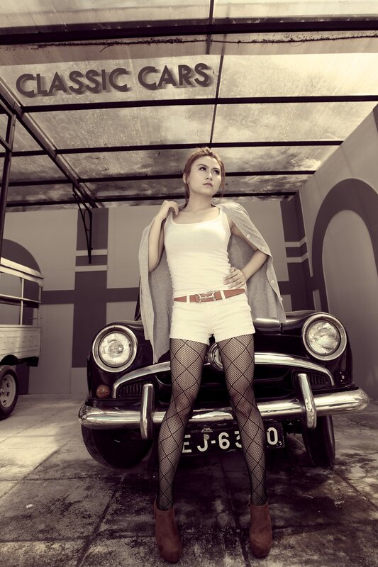 Woman in Fishnet Stockings — Black, Dramatic, Photograph, Classic Car